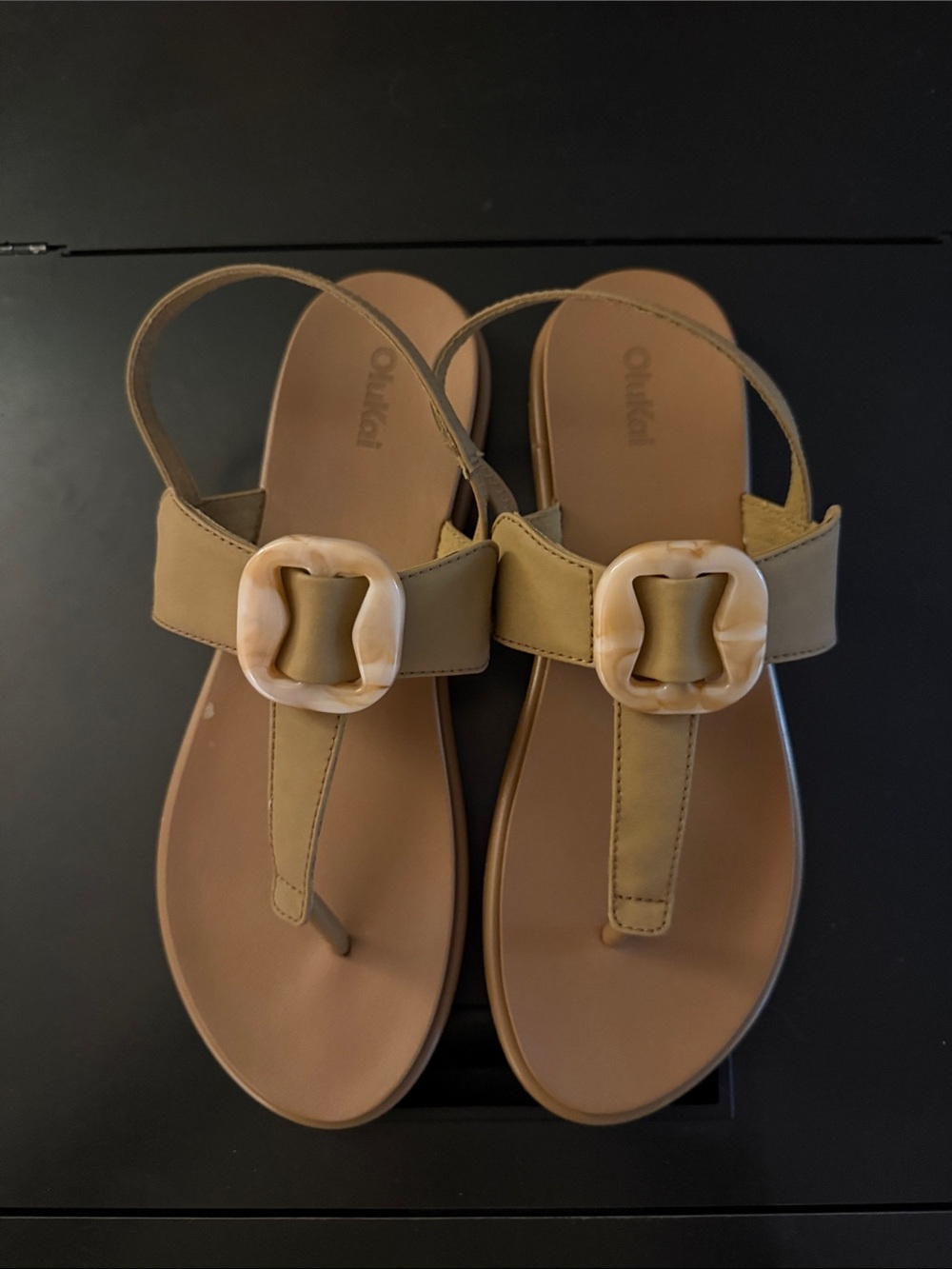 OluKai Women's Tan T-Strap Sandals with Cream Decorative Buckle